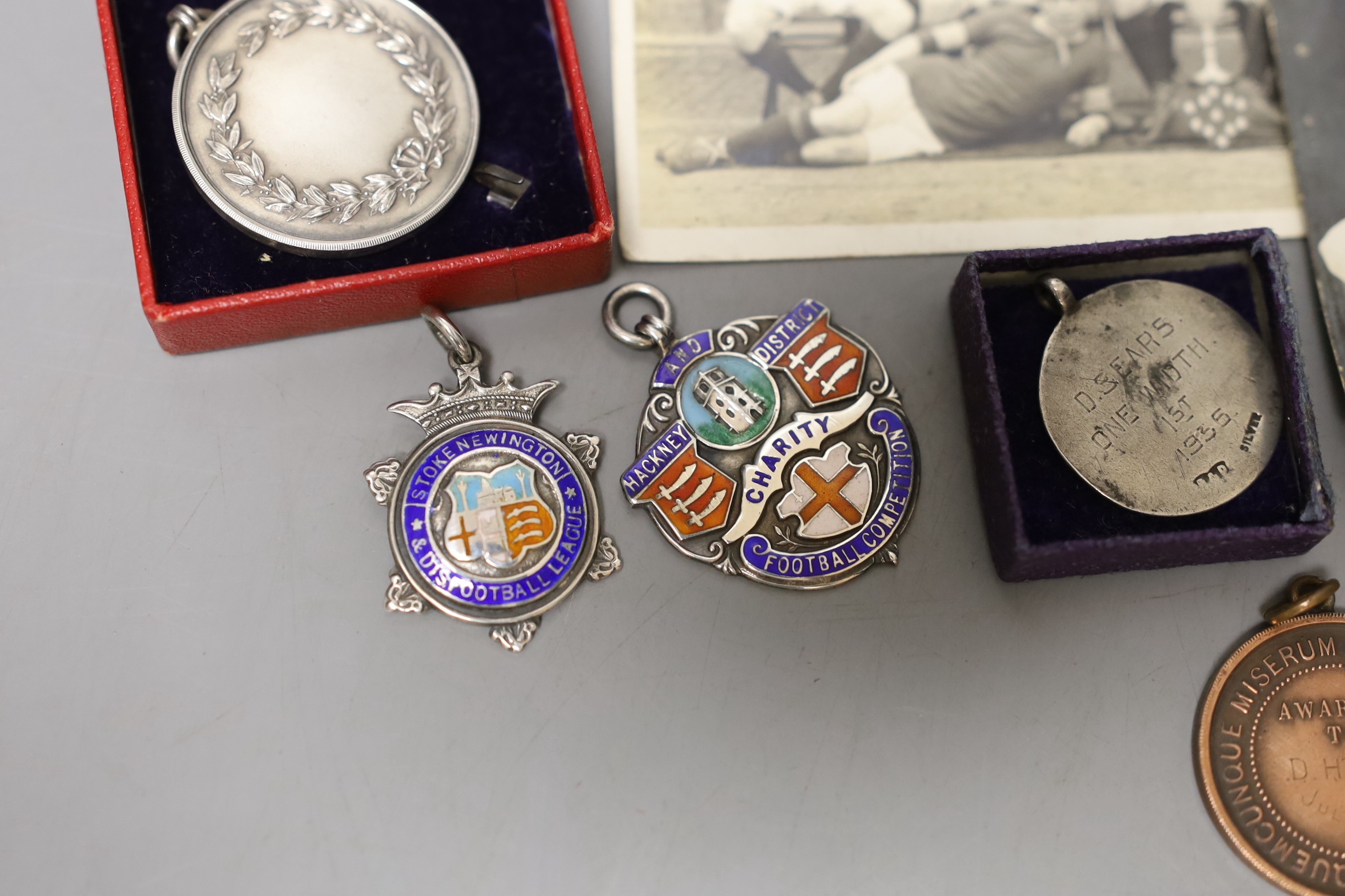 Assorted pre war football medals including silver.